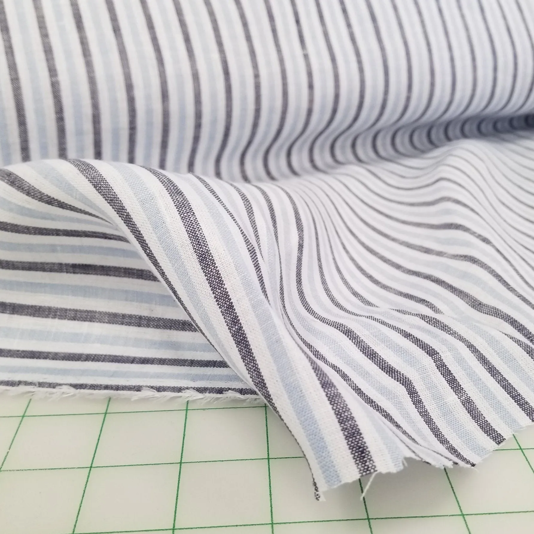 End of bolt: 2-5/8th yards of Irish Linen White and Baby Blue Vertical Stripe Spence Bryson Woven 150GSM-remnant